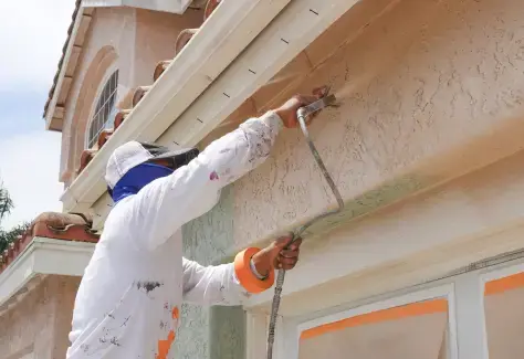 Exterior painting service showing fresh paint application on building facade