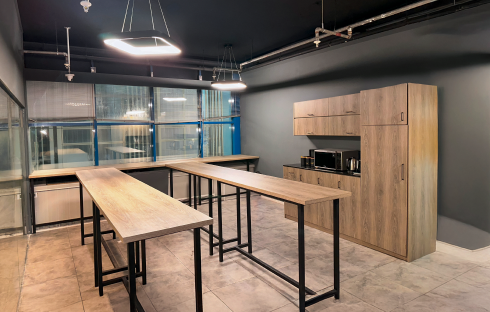 Communal breakroom with wooden tables