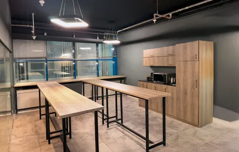 Communal breakroom with wooden tables